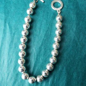 2/10$ Chaps beaded silver tone bracelet